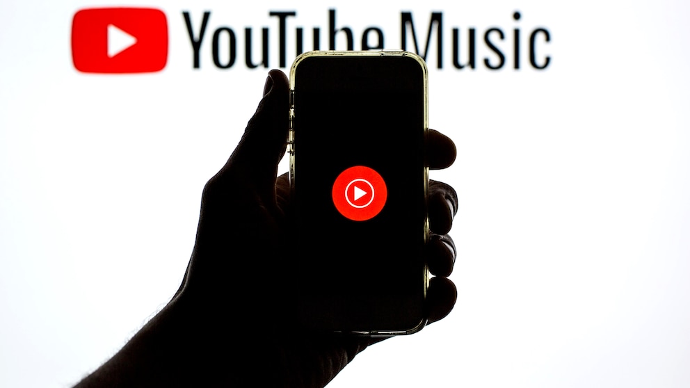 Smartphone Displays YouTube Music Logo Against YouTube Music Background
