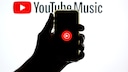 Smartphone Displays YouTube Music Logo Against YouTube Music Background