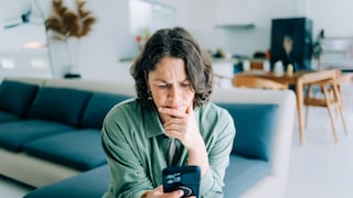 Woman Annoyed While Holding iPhone