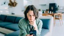 Woman Annoyed While Holding iPhone