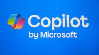 Alt-text: On a blue background, the colorful Copilot logo is displayed next to the white text "Copilot," with "by Microsoft" written underneath.