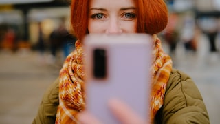 Woman Takes Selfie with Smartphone
