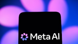 Meta AI logo on a black smartphone display against a blurred blue-violet background with glowing light spots