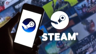 In the foreground, a smartphone displays the Steam logo. In the background, a large screen appears blurred, featuring additional Steam logos, game tiles, and the word "STEAM" in white letters.