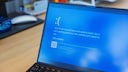Windows Laptop with Blue Screen of Death