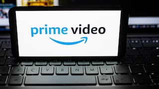 Logo for Amazon Prime Video on a smartphone resting on a laptop