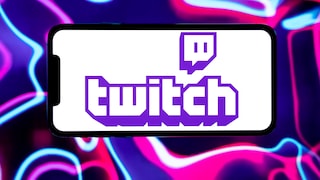 A smartphone in landscape mode against an abstract background in pink, purple, and blue. The screen displays the Twitch logo in violet on a white background. The back features curved neon lines and gradients in various shades of violet, pink, and blue.