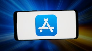 A smartphone in landscape orientation with a large app store icon on a white screen. The background features blue and orange light beams with motion blur. The device is centered in the image and set against a dark background.