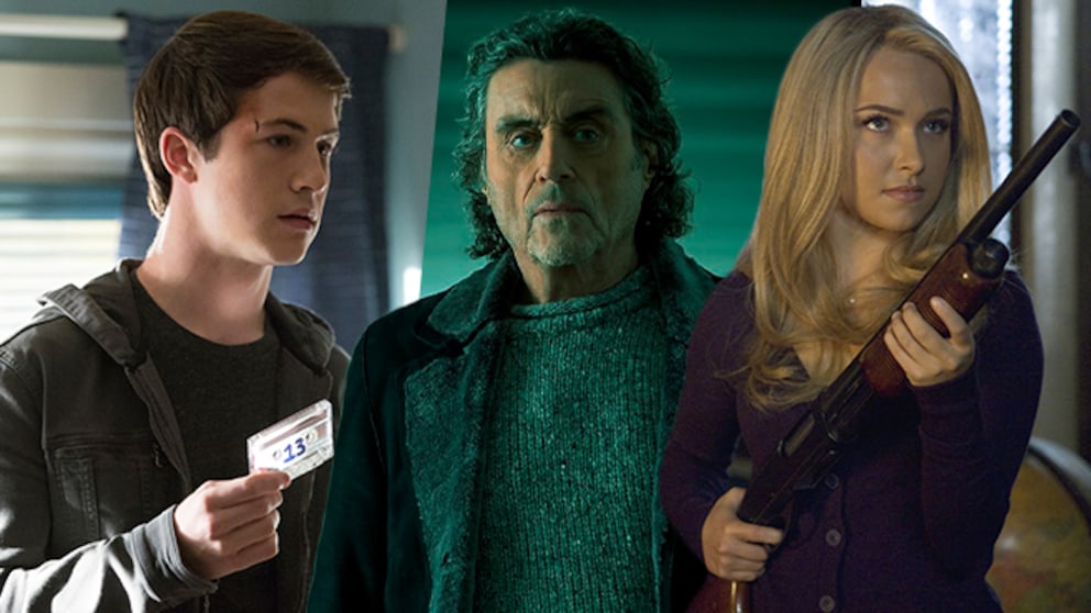 Three people stand side by side indoors. On the left, one person holds a cassette. In the middle, a person wearing a gray sweater and dark coat stands. On the right, a person with long blonde hair holds a shotgun. The background is lit in greenish and bluish tones.