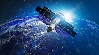 A satellite hovers in front of planet Earth. From space, one can see a network spanning the entire planet.