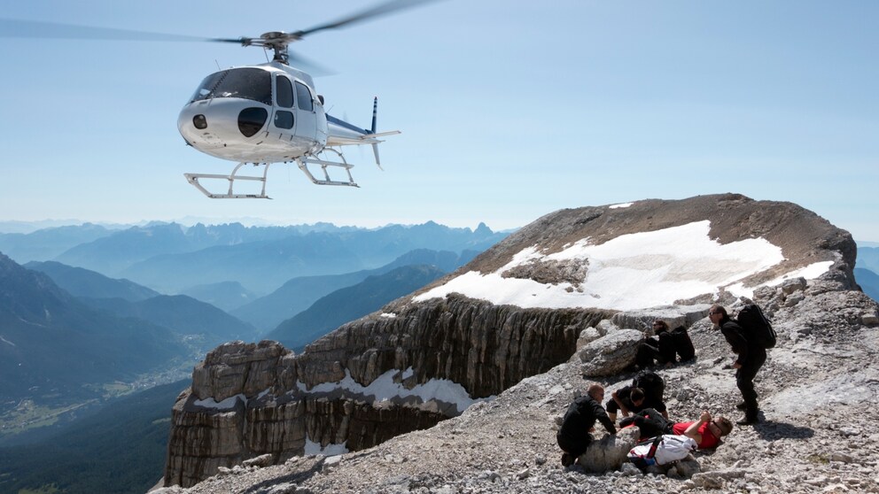 Helicopter from the Mountain Rescue Service Over a Group of Climbers