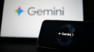 Two screens: The smaller front one displays Version 3 of Google Gemini, while the larger one in the back shows the Google Gemini logo.