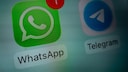 WhatsApp and Telegram logos. WhatsApp has a notification.