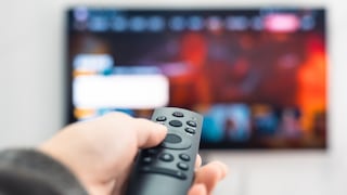 Person Points Remote at TV