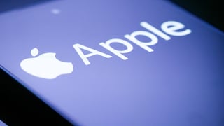 Close-up of a smartphone display featuring a white Apple logo and the Apple name on a blue background.