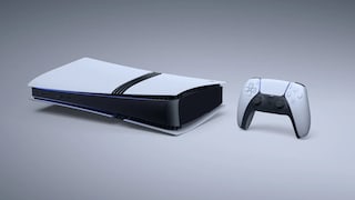 White PlayStation gaming console with a black center section on a light, neutral background. To the right is a white and black controller. The console is positioned horizontally, displaying several ports on the front. A narrow blue light strip is visible along the edge of the casing.
