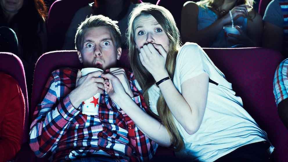 Couple Sits in Theater Watching a Terrifying Movie