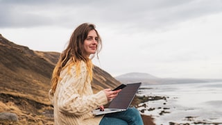 Woman in Iceland with laptop