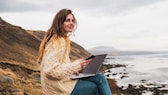 Woman in Iceland with laptop