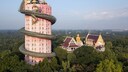 The massive dragon coils around the Wat Samphran temple in Thailand, reaching up to 80 meters high.