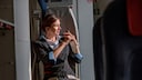 Flight Attendant Buckles Up on Jumpseat