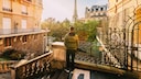 Traveler with Backpack in Front of the Eiffel Tower: Our Author Lists Five Things She Wishes She Had Known Before Her Trip to France