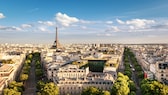 The smog has plunged the Eiffel Tower into a gray haze. Even if you stand on the nearby Place de la Concorde, you can barely make out half of the Parisian landmark.