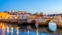 View of the river Gilao and the Roman bridge that connects the two districts of Tavira