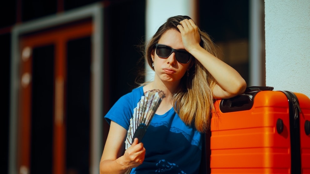 Woman Sweats at Airport Due to Heat