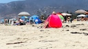 Beachgoers at the Beach Sprawling