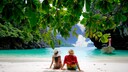 Can you identify this travel destination where it's still warm in December?