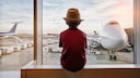 Boy Looks at Airplane