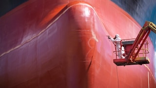 Man in Front of Red Ship