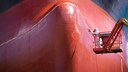 Man in Front of Red Ship