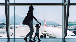 Mother with Child at the Airport