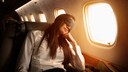 Woman Tries to Sleep on Long-Haul Flight