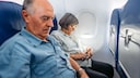Older People Sitting Side by Side on the Plane