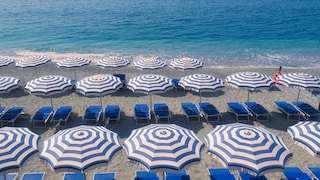 Beach umbrellas and loungers in Monterosso al Mare, Italy