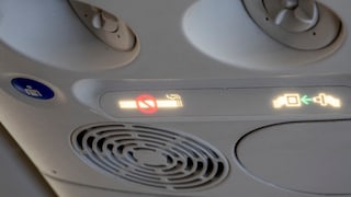 During flight turbulence, the seatbelt signs are turned back on.