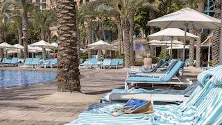 Reserving lounge chairs at the hotel pool is a daily routine for many vacationers.