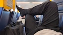 Many airline passengers enjoy making themselves comfortable when the seats next to them are empty. But is that allowed?