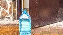 Bottles Placed in Front of Doors in Italy–What It Means