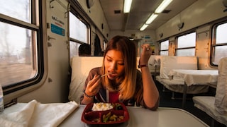 Train in China: Girl Eats on Board
