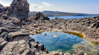 On Pantelleria, numerous natural pools are nestled amid volcanic rock.